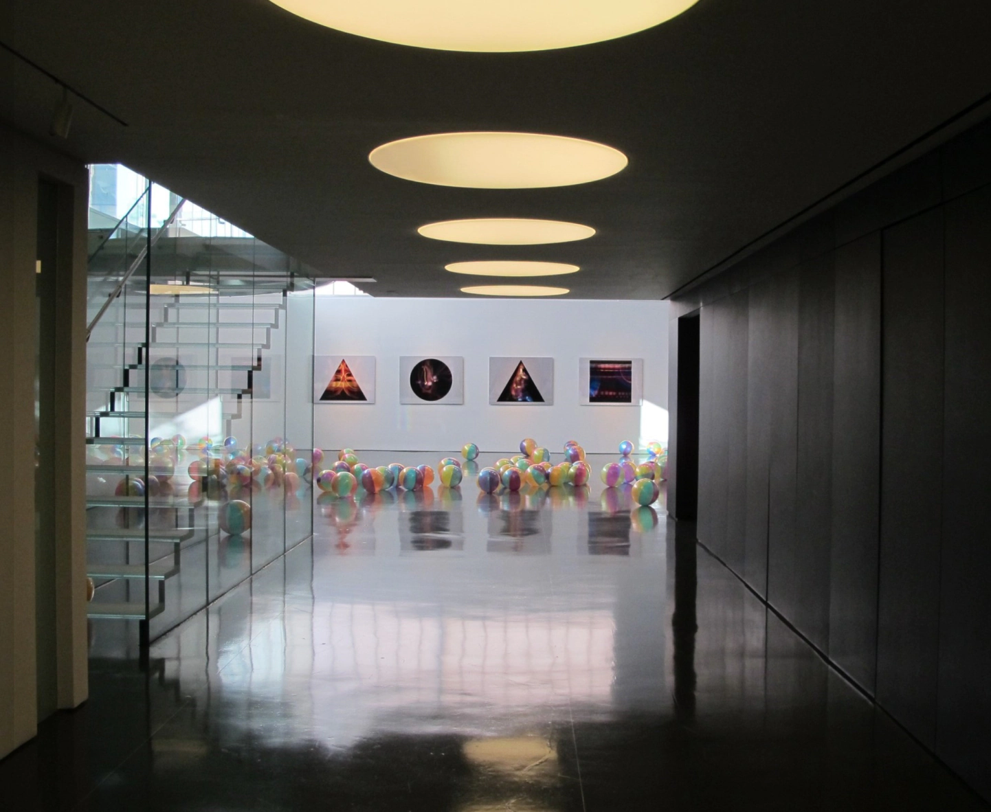 hallway with paintings at the end